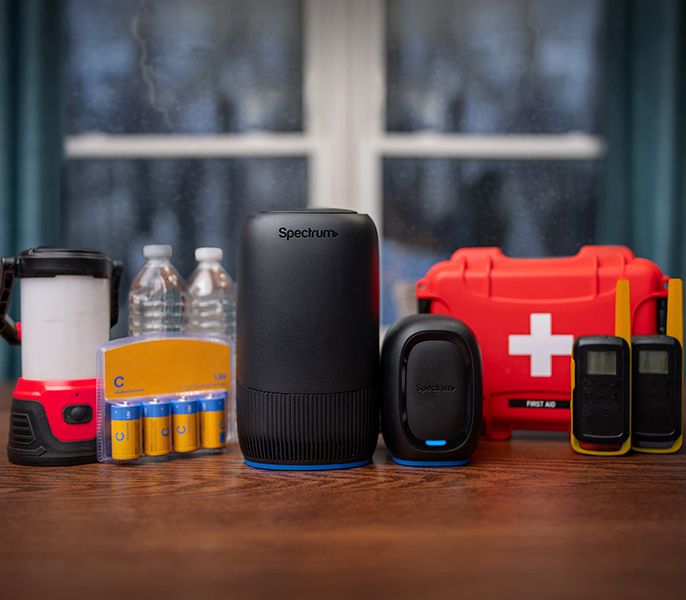 Spectrum WiFi 7 router pictured with emergency supplies