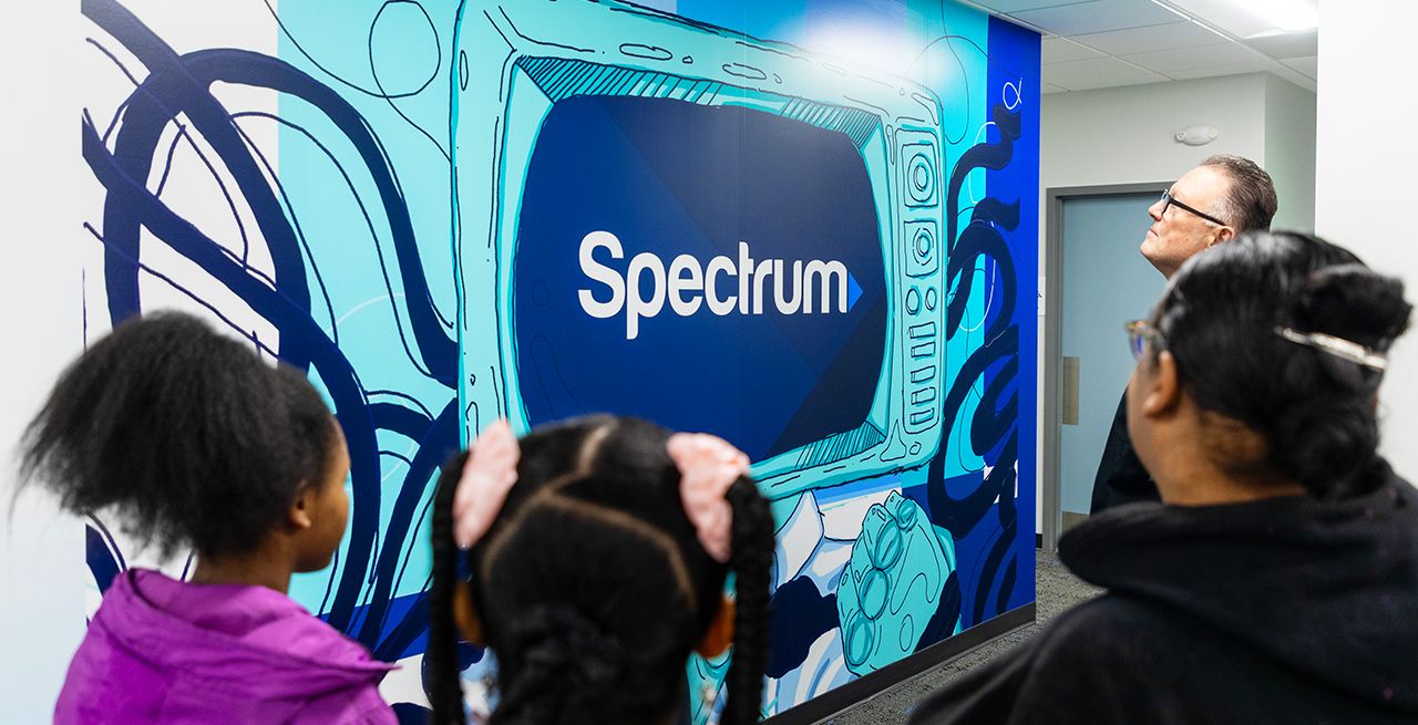 Mural of Spectrum logo on a large TV