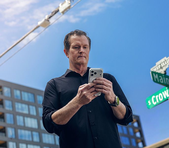 Someone using their smartphone to connect to WiFi access point