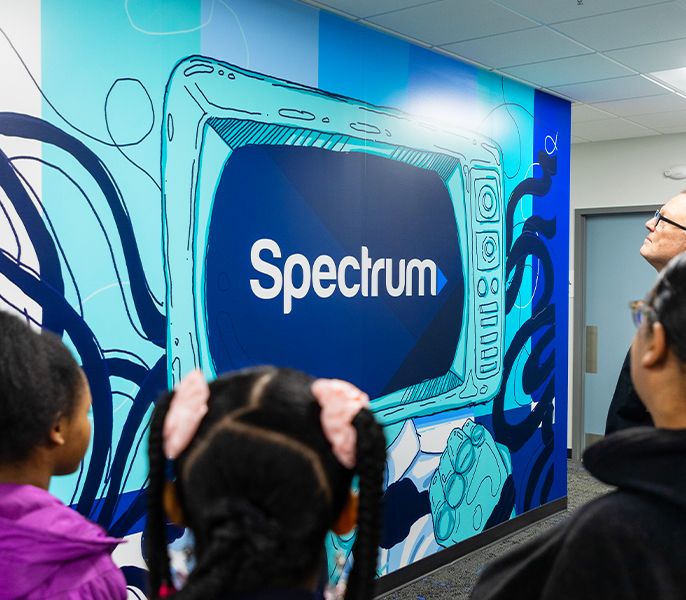 Mural of a Spectrum logo on a large TV