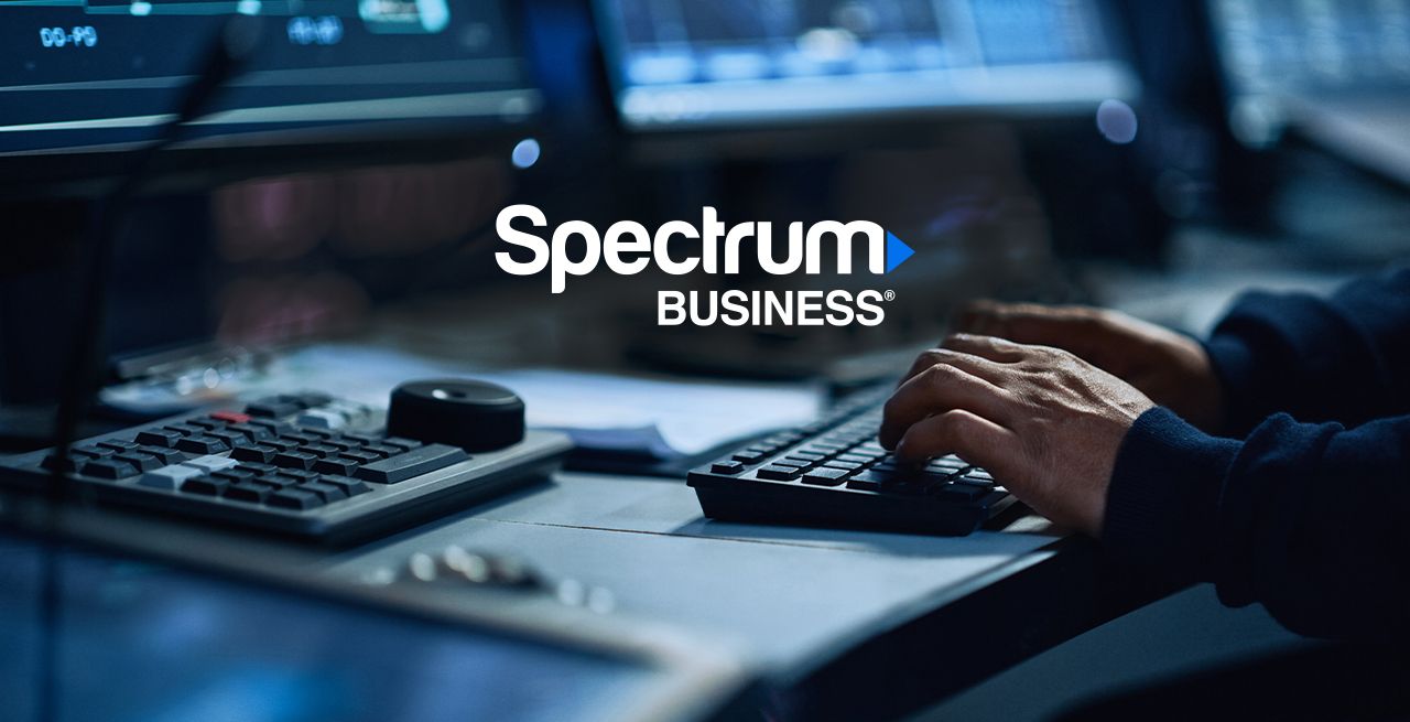 Someone using a desktop computer hands showing on keyboard only