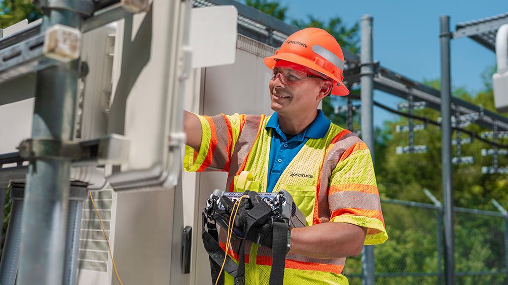 A Spectrum field technician working on the network