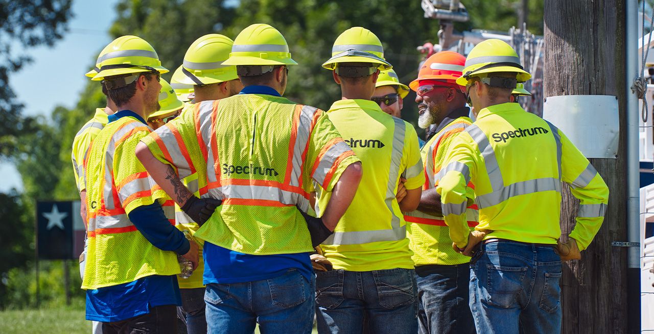 A group of Spectrum field technicians meeting