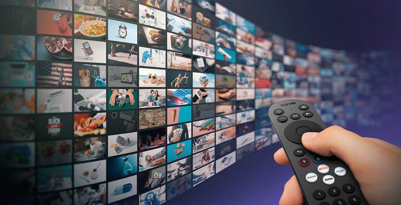 Xumo remote with video advertising content shown on wall of screens
