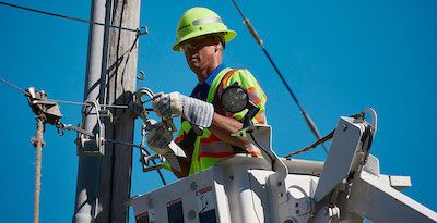 Worker on telephone pole