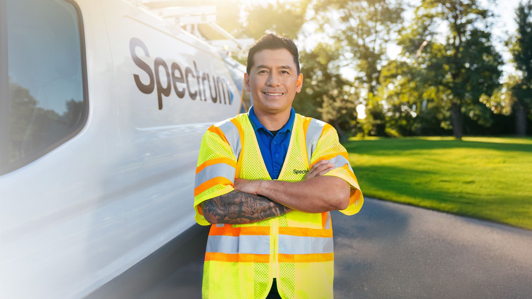 Spectrum technician standing by a Spectrum van