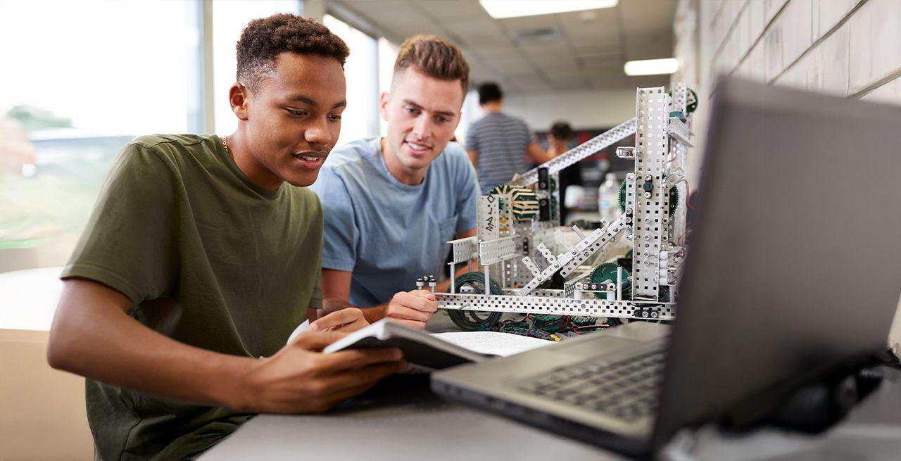 Two students working on a computer